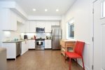 The kitchen, dining and living areas are all open with lots of windows, creating a great open feeling.